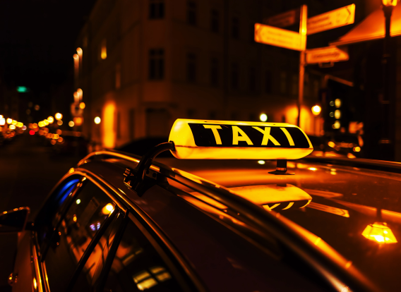 Header - Taxi Photo of a taxi cab at night.